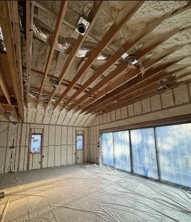Interior walls and ceiling insulated with spray foam during new construction in Rockwood